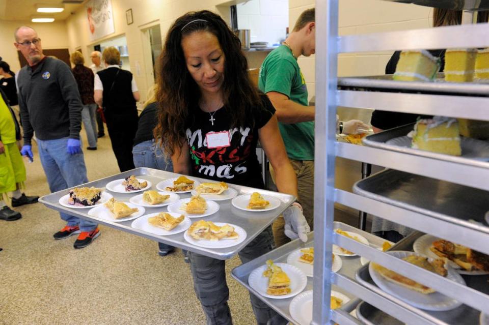 Volunteer Pinky Taylor organizes desserts for the Christmas day meal at Bradenton’s Salvation Army.