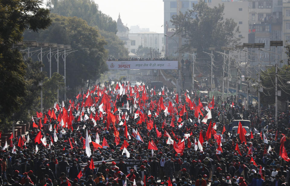 Nepalese supporters of the splinter group in the governing Nepal Communist Party participate in a protest in Kathmandu, Nepal, Tuesday, Dec. 29, 2020. Tens of thousands of supporters of the splinter group rallied in the capital on Tuesday demanding the ouster of the prime minister and the reinstatement of the Parliament he dissolved amid an escalating feud in the party. (AP Photo/Niranjan Shrestha)