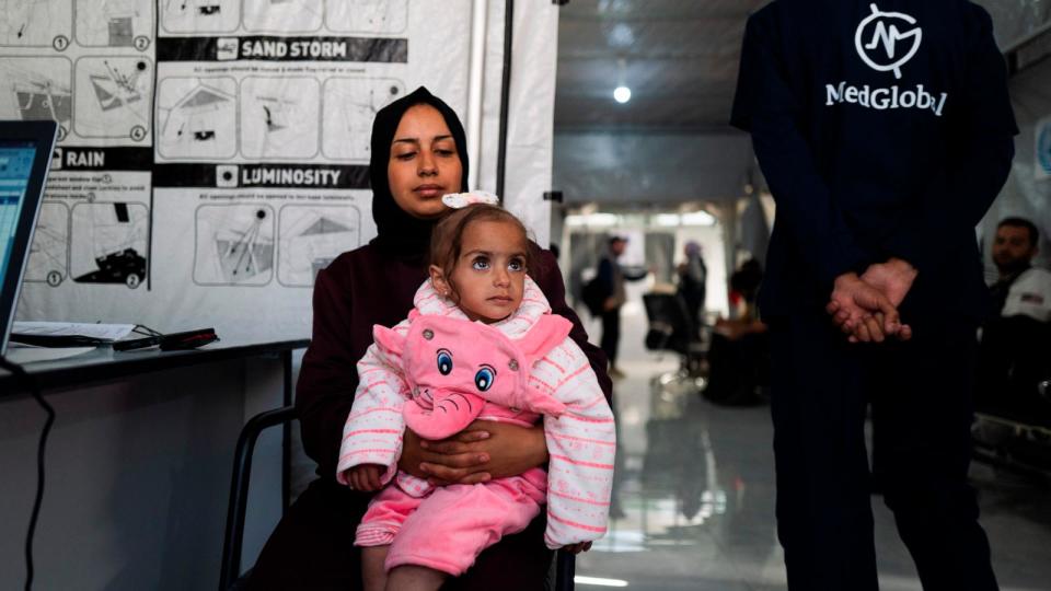 PHOTO: A woman and her daughter sit at a nutritional stabilization center in Gaza in March, in a photo supplied by MedGlobal.  (MedGlobal)