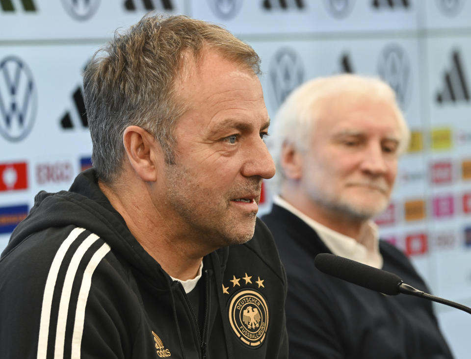 DFB Sports Director Rudi Voeller, right, and national men soccer team coach Hansi Flick, left, attend a news conference of the German Football Association, DFB, at the DFB Campus in Frankfurt, Germany, Monday, March 20, 2023. (Arne Dedert/dpa via AP)
