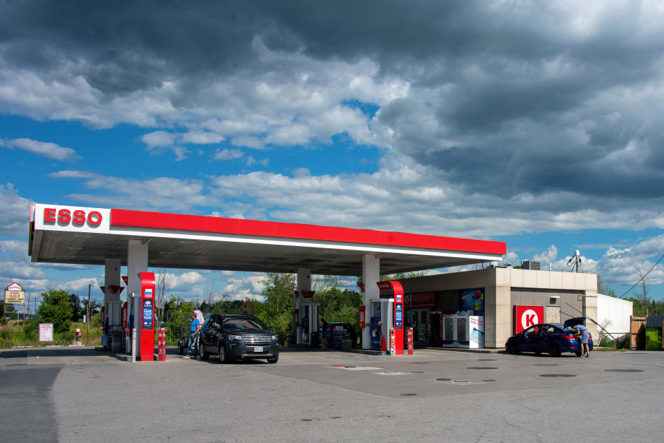 Peterbourgh, Canada - August 14, 2022: Esso station and Circle K convenience store on Hwy 7 on a sunny day with a cloudy sky.