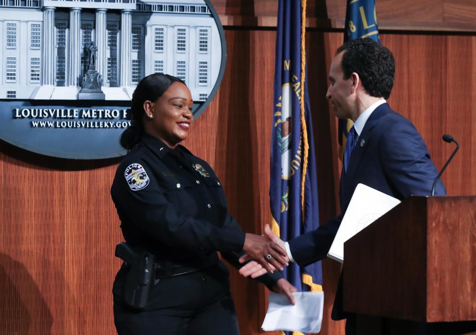 Interim Louisville Police Chief Jacquelyn Gwinn-Villaroel, left, shook hands with Mayor Craig Greenberg after he announced that she has been selected as the permanent chief of the LMPD following a nationwide search in Louisville, Ky. on July 20, 2023.