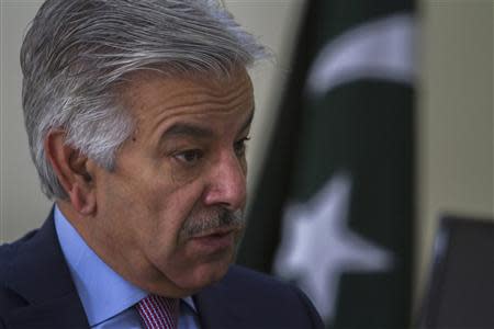 Pakistan's Defence Minister Khawaja Asif speaks during an interview with Reuters at his office in Islamabad March 6, 2014. REUTERS/Faisal Mahmood