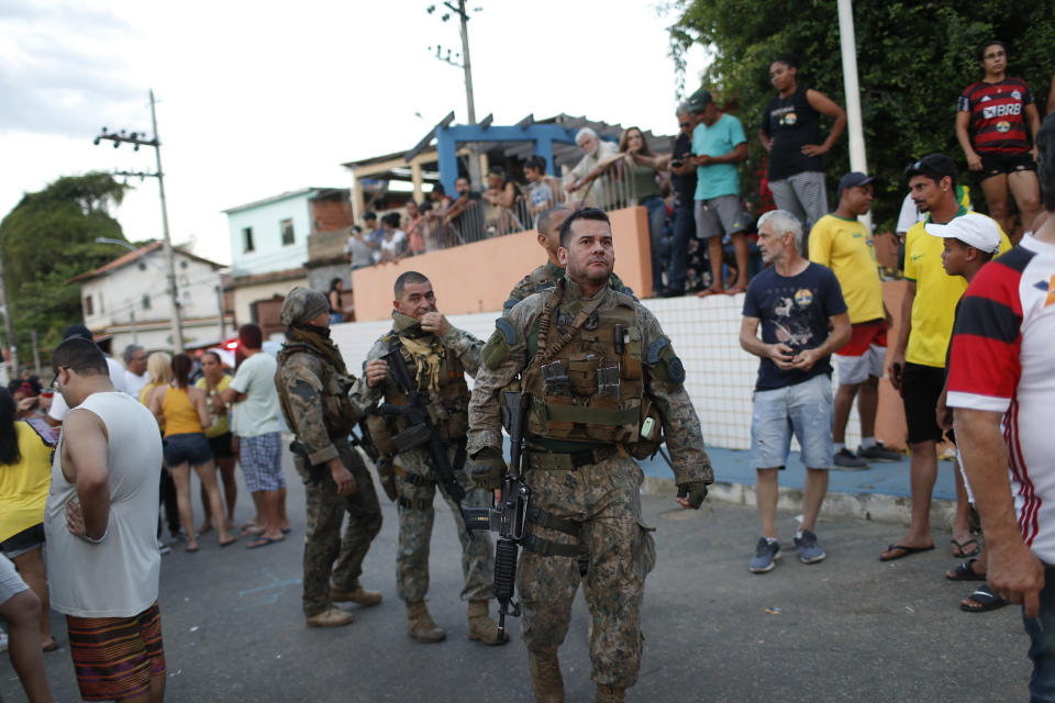 Police officers stand walk near former lawmaker Roberto Jefferson´s home in Levy Gasparian, Rio de Janeiro state, Brazil, Sunday, Oct. 23, 2022. Jefferson, an ally of Brazilian President Jair Bolsonaro, fired gunshots and a grenade at federal policemen who tried to arrest him in for insulting supreme court ministers, according to Brazil’s federal police. (AP Photo/Bruna Prado)