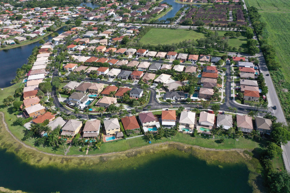 MIAMI, FLORIDA - MAY 10:  In an aerial view, single family homes are shown in a residential neighborhood on May 10, 2022 in Miami, Florida. New published data has hinted at improvement in the supply of homes for sale as April's numbers show inventory down 12 percent from the same month last year, the smallests yearly decline since the end of 2019.  (Photo by Joe Raedle/Getty Images)