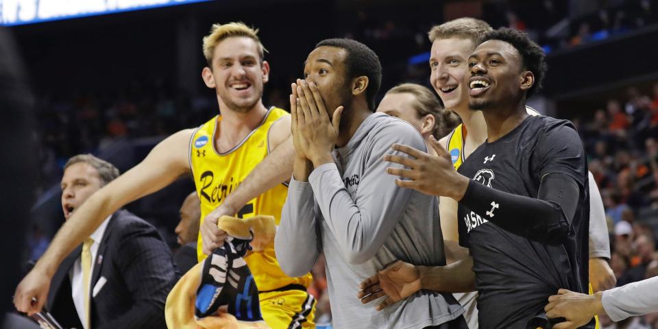 UMBC players celebrate from the bench during a NCAA Tournament game in 2018.