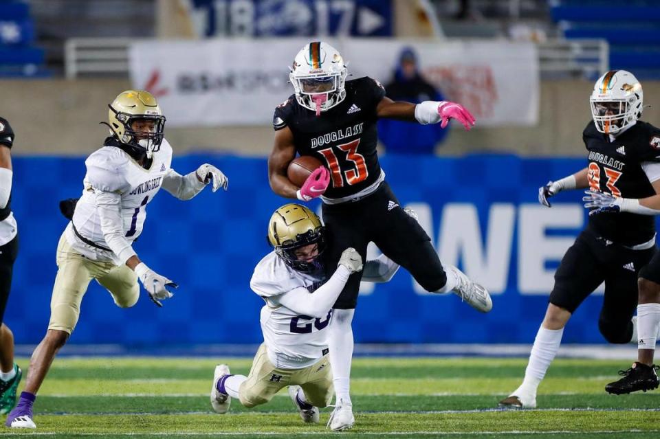 Ty Bryant (13) was named Class 5A state championship game MVP after scoring a touchdown on offense and intercepting a pass on defense.