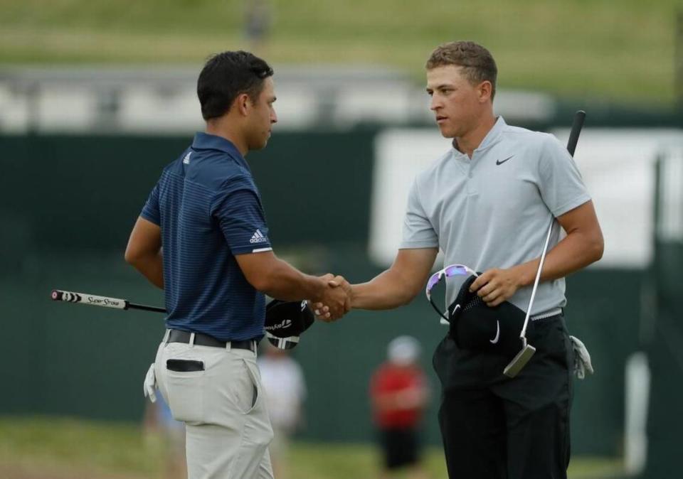 Cameron Champ, right, shakes hands with Xander Schauffele after their third round of the U.S. Open golf tournament on Saturday, June 17, 2017, at Erin Hills in Erin, Wisconsin.