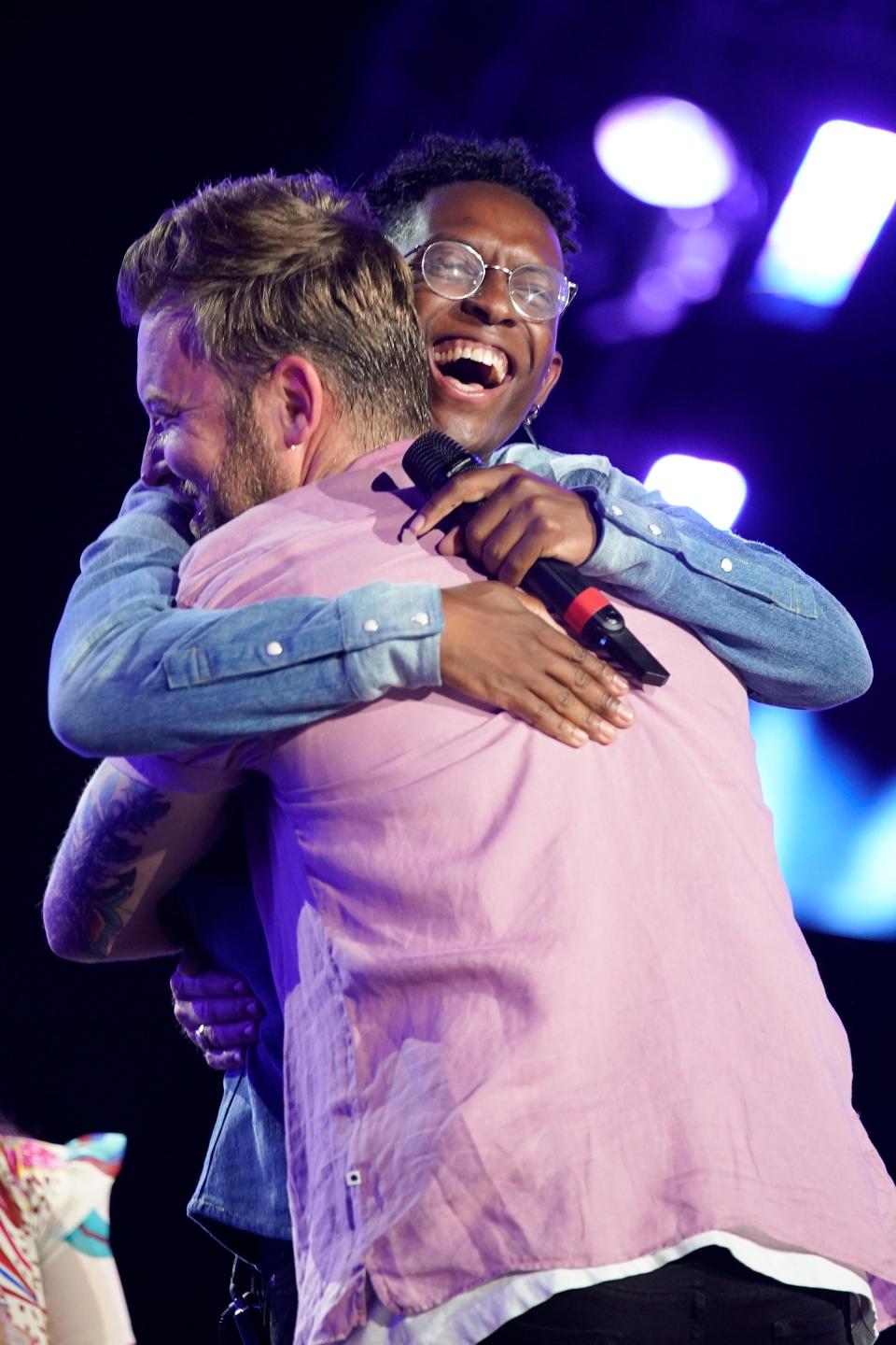 Charles Kelley of Lady A embraces BRELAND after they performed together during CMA Fest at Nissan Stadium Sunday, June 12, 2022 in Nashville, Tennessee.