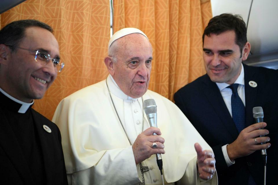 Pope Francis greets reporters during his flight from Rome, Italy, to Sofia, Bulgaria, Sunday, May 5, 2019. Pope Francis is paying a three day visit to Bulgaria and North Macedonia in his 29th Apostolic Journey abroad. (Maurizio Brambatti/Pool via AP)