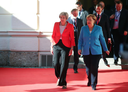 German Chancellor Angela Merkel and Britain's Prime Minister Theresa May arrive for the informal meeting of European Union leaders in Salzburg, Austria, September 20, 2018. REUTERS/Lisi Niesner