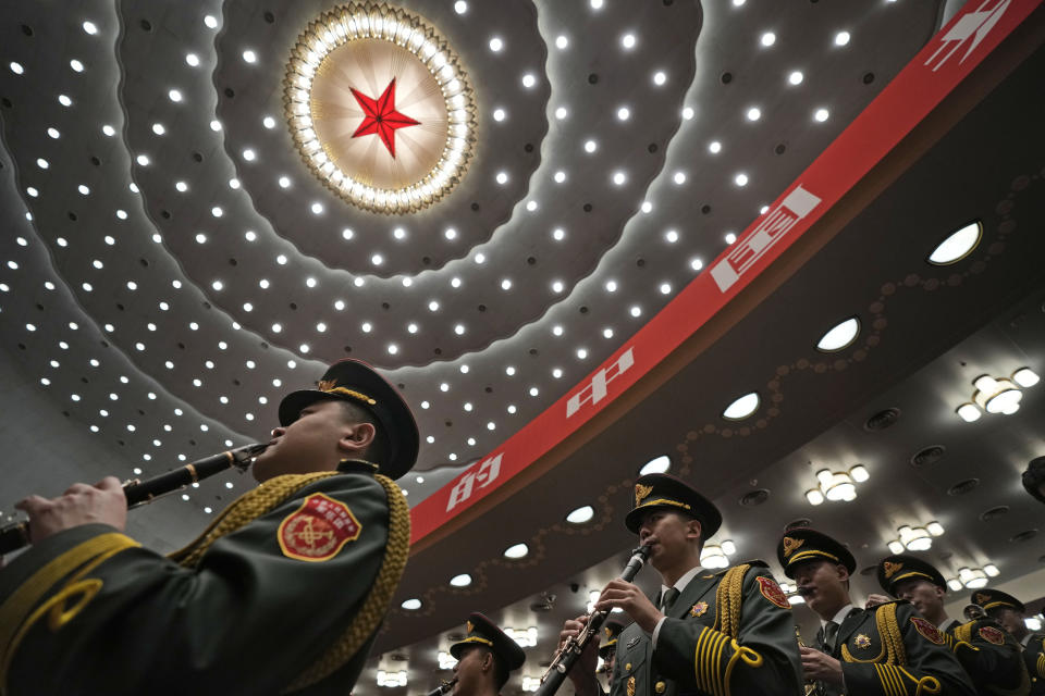 The military band rehearses at the Great Hall of the People before the opening ceremony for the 20th National Congress of China's ruling Communist Party in Beijing, China, Sunday, Oct. 16, 2022. China on Sunday opens a twice-a-decade party conference at which leader Xi Jinping is expected to receive a third five-year term that breaks with recent precedent and establishes himself as arguably the most powerful Chinese politician since Mao Zedong. (AP Photo/Mark Schiefelbein)