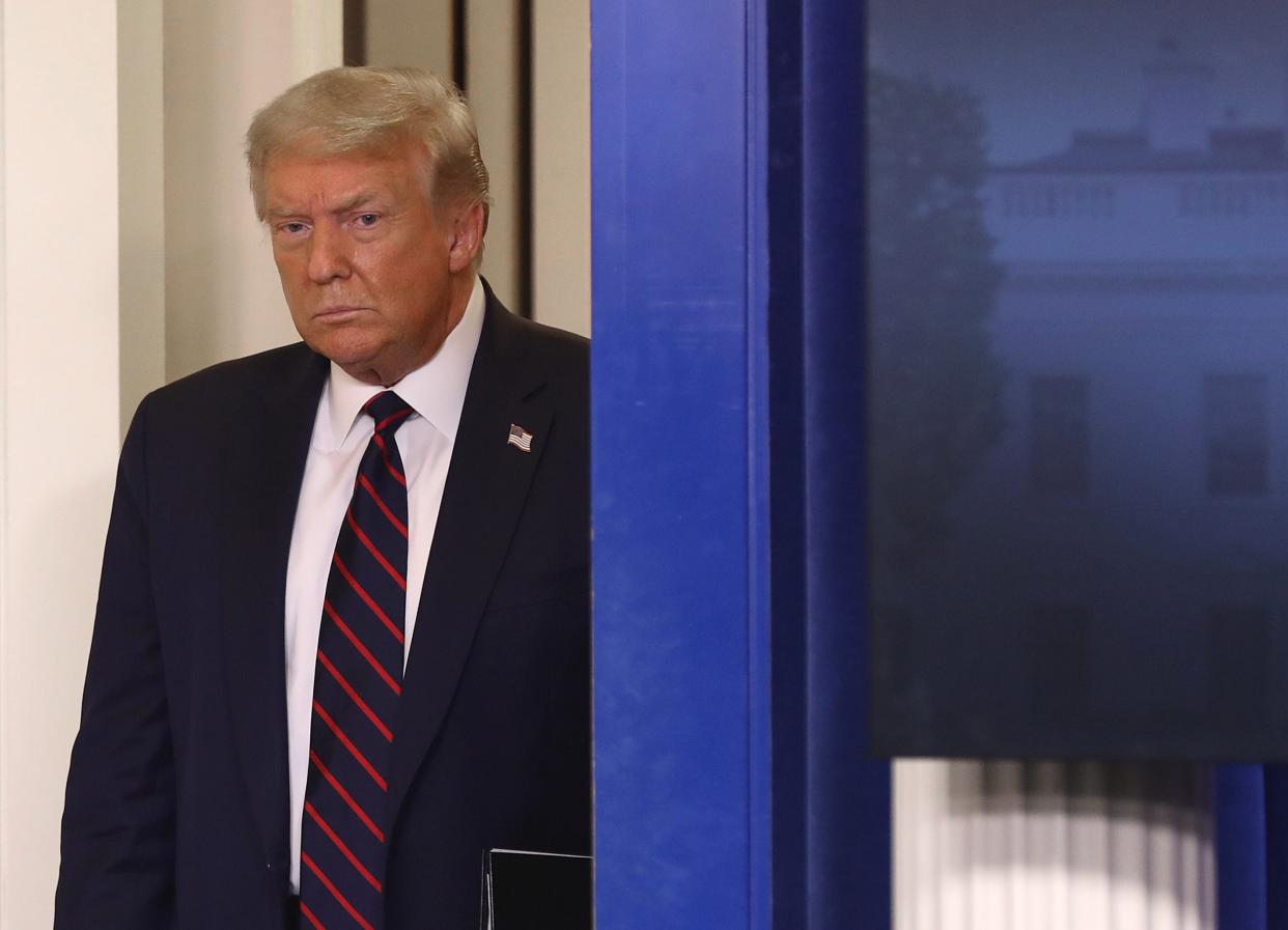 Donald Trump arrives for a news conference on the coronavirus in the Brady Press Briefing Room at the White House: Getty Images