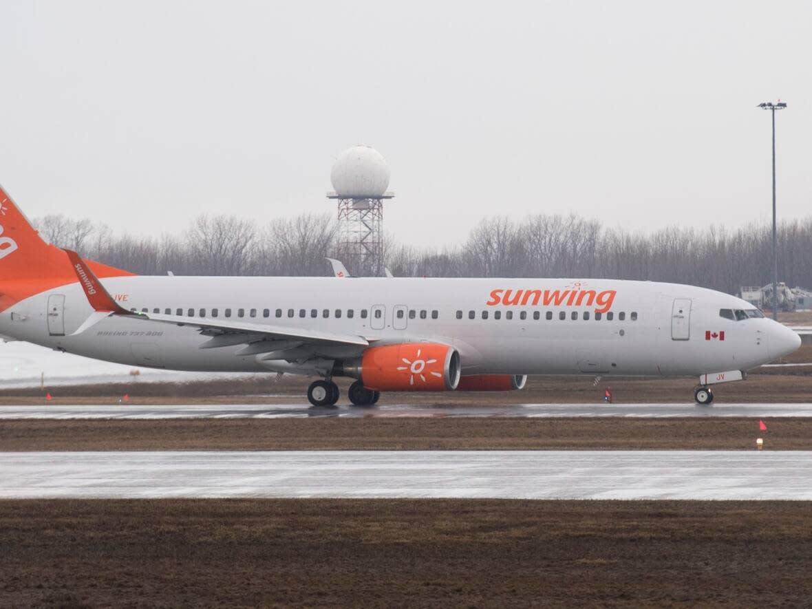 A 2020 file photo shows a Sunwing Airlines jet prepare for takeoff at Montreal's Trudeau International Airport. (Graham Hughes/The Canadian Press - image credit)