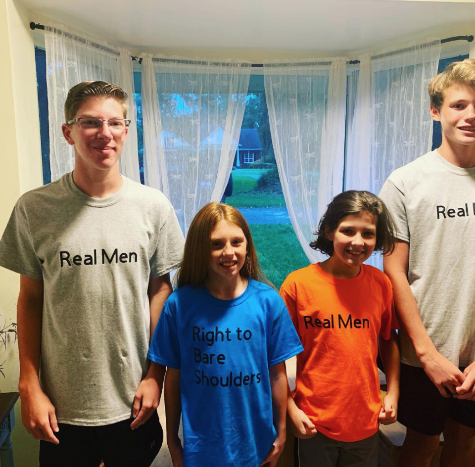 In response to a dress code violation, students wore t-shirts that read "right to bare shoulders" and "Real men aren't distracted by shoulders" to school. (Photo: Kate Darrow)