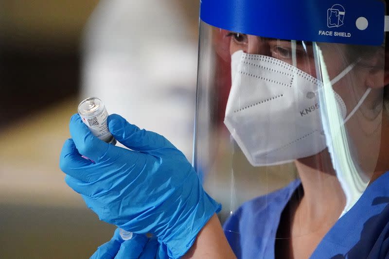 FILE PHOTO: Workers of the FDNY EMS receive COVID-19 Moderna vaccine in New York