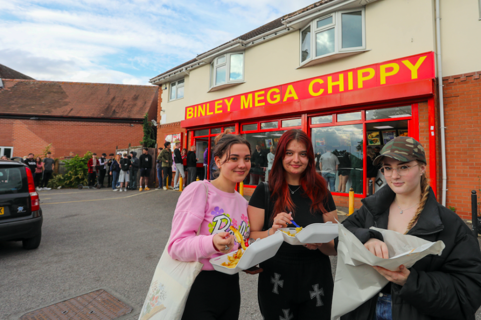 Customers (L-R) Erika, Maggie and Jagoda from Coventry eating their chips outside Binley Mega Chippy in Coventry. (SWNS)