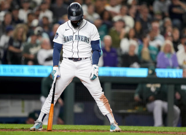 Eugenio Suarez of the Seattle Mariners reacts after his walk-off