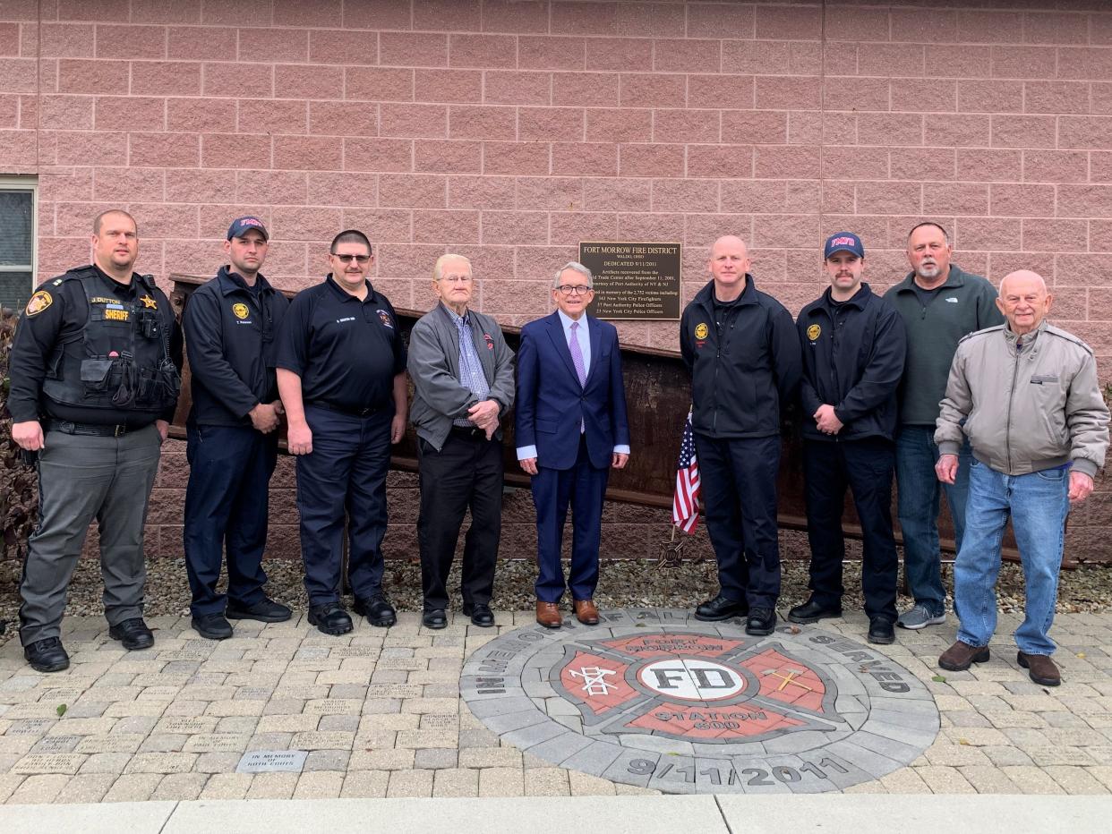 Governor Mike DeWine posed with Fort Morrow Fire Department staff and Waldo residents including Mayor Bruce Baker Dec. 7 following the announcement of the new water system grant.