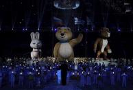 The Olympic mascots of a hare, a bear and a leopard (L-R) take part in the closing ceremony for the 2014 Sochi Winter Olympics, February 23, 2014. REUTERS/Phil Noble (RUSSIA - Tags: OLYMPICS SPORT)