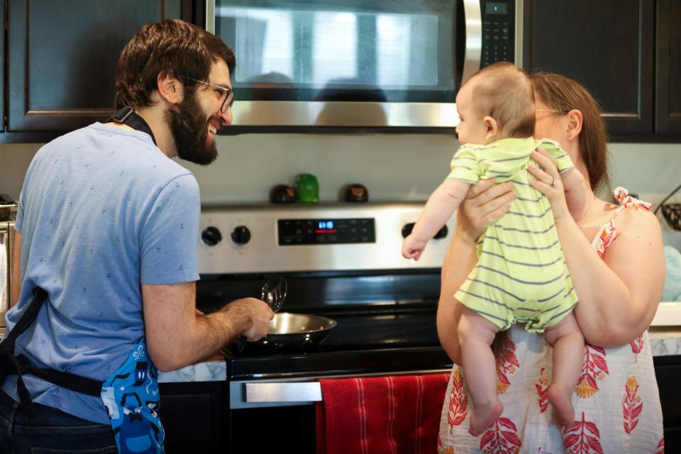 Michael, 34, and Lauren Kleiman, 29, play with their 4-month-old baby while making lunch in their new home, Saturday, Aug. 19, 2023, in Port St. Lucie. The couple moved into the newly built home in December 2022 from Margate. "The only way to afford the house was the student loan pause," said Michael. "We were able to save for the down payment and for emergency funds." Port St. Lucie is the fourth best city across the nation for buying a first home, according to a study conducted by WalletHub published in July 2023.