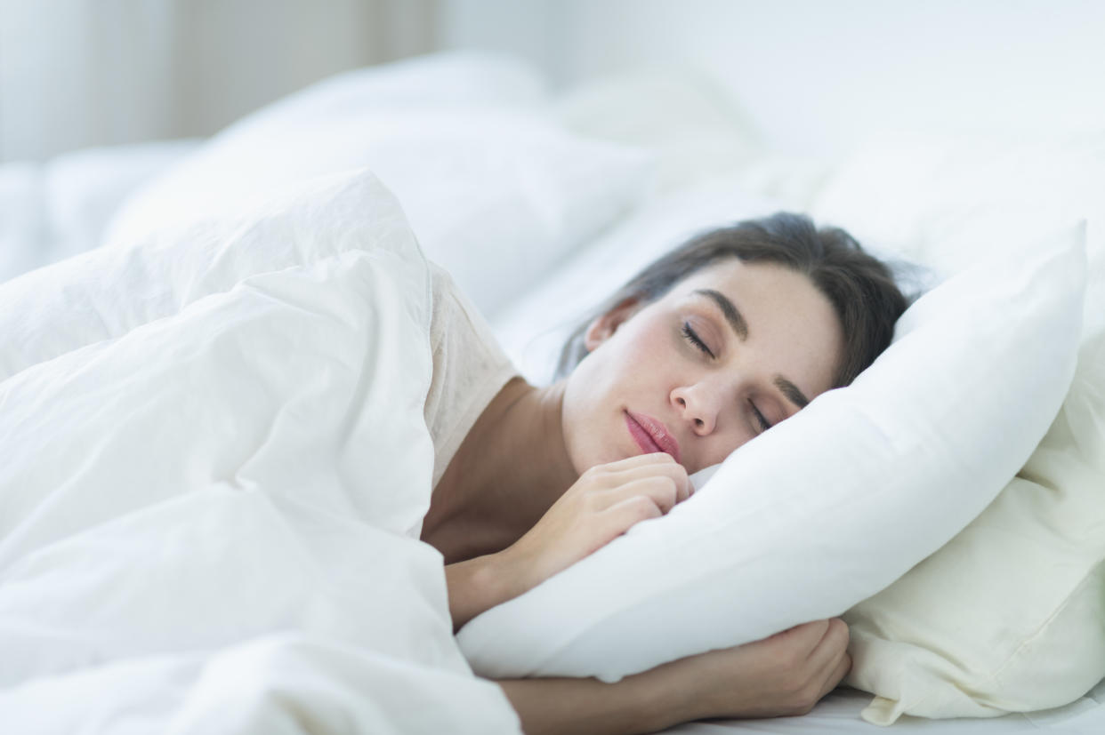 Turns out, there’s a reason silk pillowcases are popping up everywhere from Walmart to Amazon and it has to do with your hair and skin. (Photo: Getty Images)