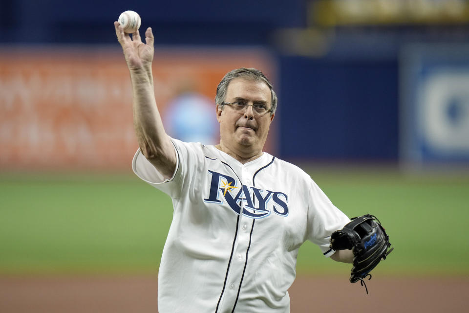 Marcelo Ebrard, Mexico's Secretary of Foreign Affairs, throws out the ceremonial first pitch before a baseball game between the Rays and the Milwaukee Brewers Sunday, May 21, 2023, in St. Petersburg, Fla. (AP Photo/Chris O'Meara)