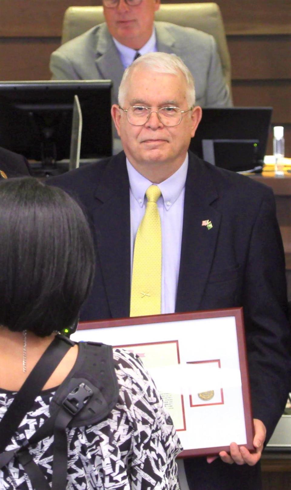 Fort Benning presented resigning Columbus Councilor John House with a meritorious civilian service award at his last council meeting.