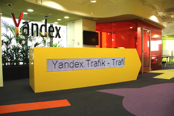 Yandex office front desk with company logo in the background