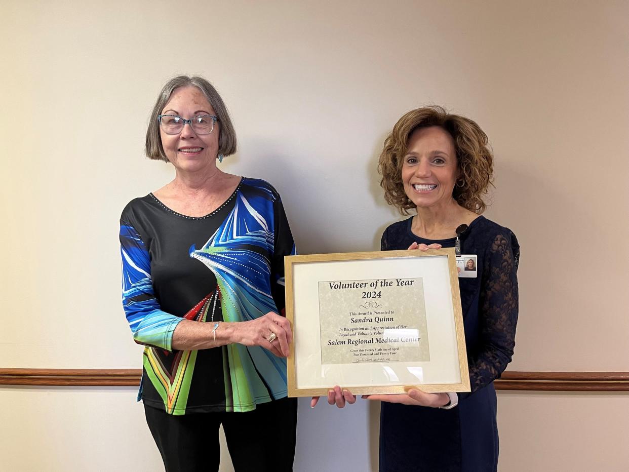 Salem Regional Medical Center volunteer Sandra Quinn has been named the medical center's Volunteer of the Year for 2024. Here, she is receiving her award from SRMC President and CEO Dr. Anita Hackstedde.