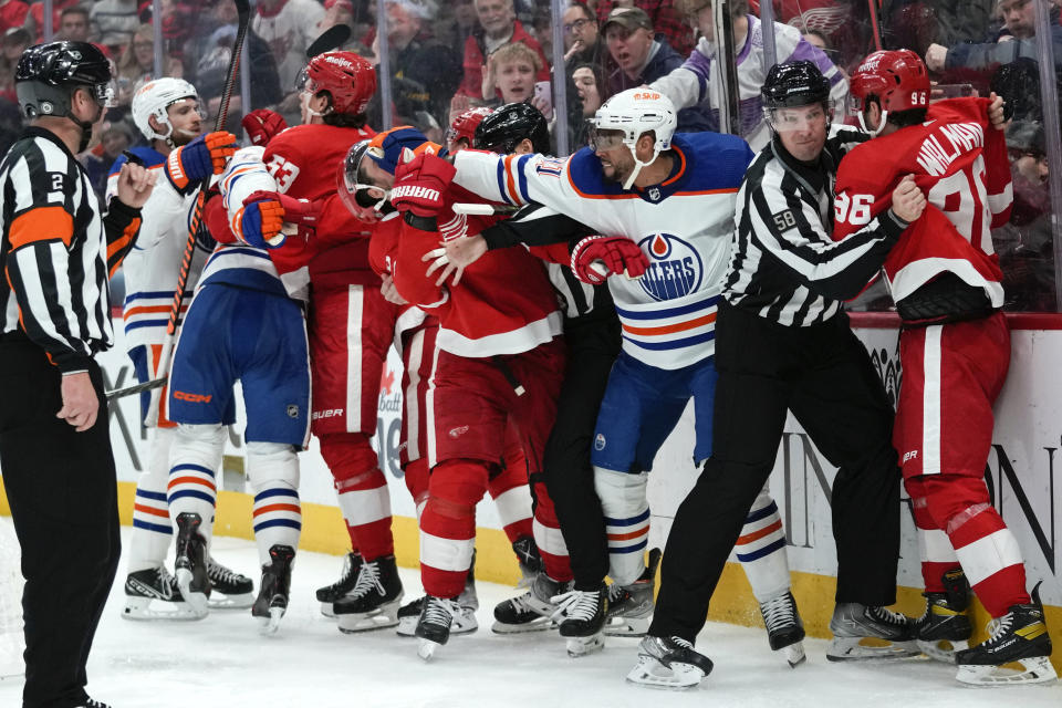 Edmonton Oilers left wing Evander Kane (91) punches Detroit Red Wings center Dylan Larkin (71) in the third period of an NHL hockey game Tuesday, Feb. 7, 2023, in Detroit. (AP Photo/Paul Sancya)