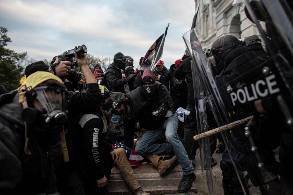 Pro-Trump mob clashes with police as they try to breach the US Capitol on 6 January.