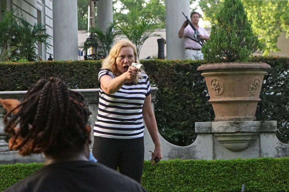 Patricia McCloskey pointed a pistol at the protesters (REUTERS)