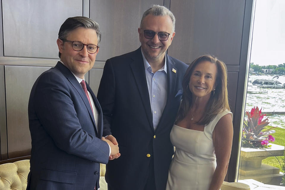 This image provided by John Akouri, shows, from left, House Speaker Mike Johnson, R-La., Massad Boulos, Tiffany Trump's father-in-law, and Rep. Lisa McClain, R-Mich., posing for a photo June 1, 2024, in Waterford Township, Mich. Boulos, a Lebanese businessman whose son married Tiffany Trump two years ago is now helping Donald Trump with outreach in the Arab American community. Massad Boulos has traveled to Michigan twice in recent weeks for meetings with nearly 50 members of the Arab American community in addition one-on-one sessions with community leaders. (AP Photo/John Akouri)