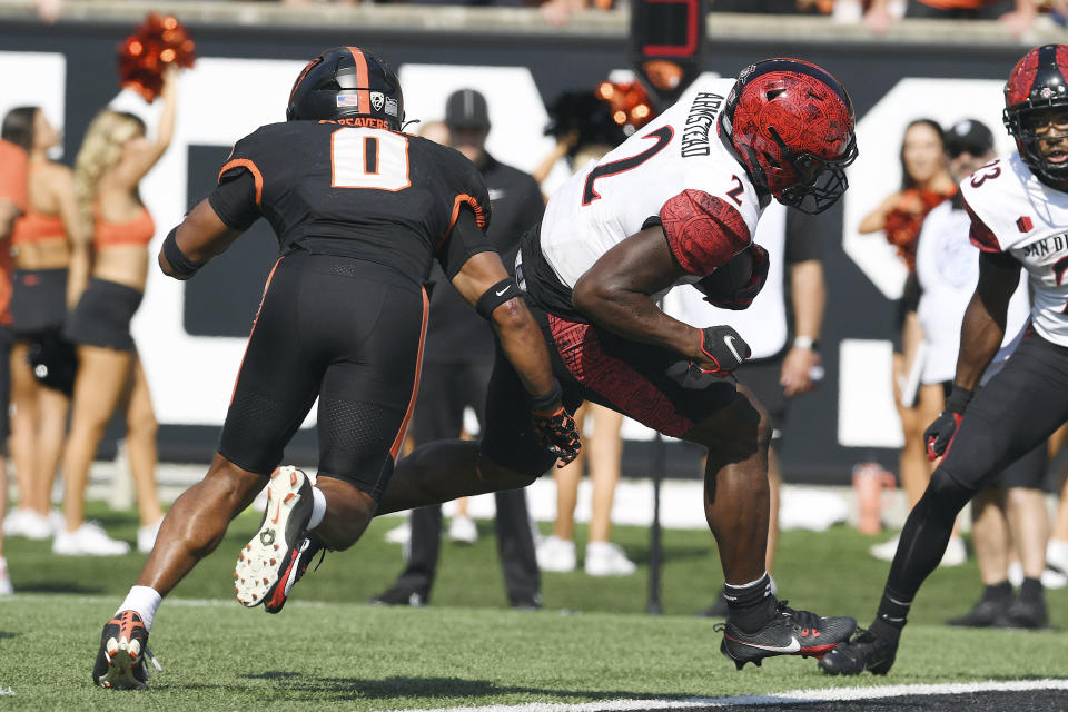 San Diego State running back Jaylon Armstead (2) scores in front of Oregon State defensive back Akili Arnold (0) during the second half of an NCAA college football game Saturday, Sept. 16, 2023, in Corvallis, Ore. (AP Photo/Mark Ylen)