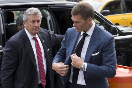 New England Patriots' quarterback Tom Brady (R) arrives at the Manhattan Federal Courthouse in New York August 31, 2015. REUTERS/Brendan McDermid