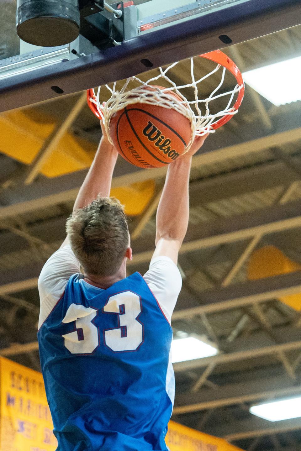 Indiana Junior All-Star Trent Sisley (33) goes for a dunk during their game against the Kentucky All-Stars on Sunday, June 2, 2024 in Scottsburg, Ind. at Charles E. Meyer Gymnasium for the first game of the Indiana vs Kentucky All-Stars basketball week.