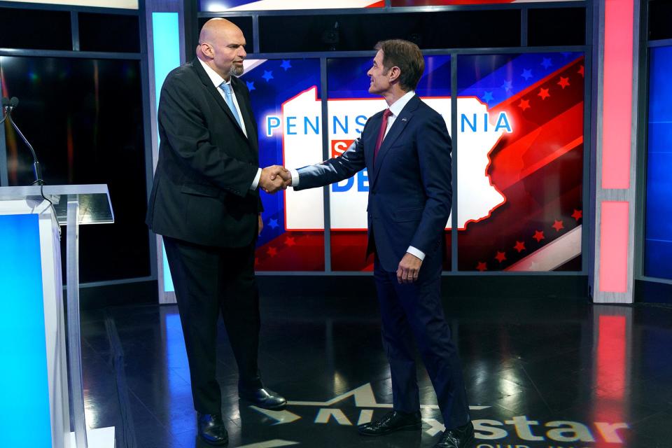 Pennsylvania Democratic Senate candidate Lt. Gov. John Fetterman, left,  and Republican candidate Dr. Mehmet Oz shake hands prior to the Nexstar Pennsylvania Senate at WHTM abc27 in Harrisburg, Pa., on Tuesday, October 25, 2022.