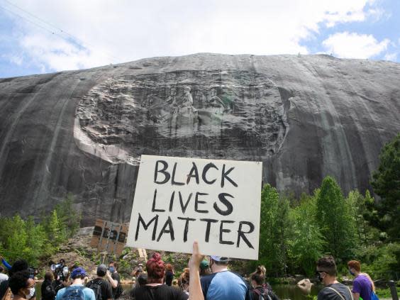 (Getty Images) A Black Lives Matter protest in front of the Stone Mountain Confederate Memorial