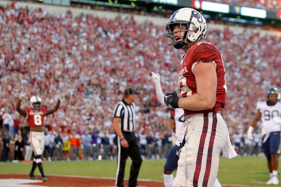 Oklahoma's Austin Stogner (18) celebrates after a touchdown during a college football game between the University of Oklahoma Sooners (OU) and the West Virginia Mountaineers at Gaylord Family-Oklahoma Memorial Stadium in Norman, Okla., Saturday, Sept. 25, 2021. Oklahoma won 16-13. 