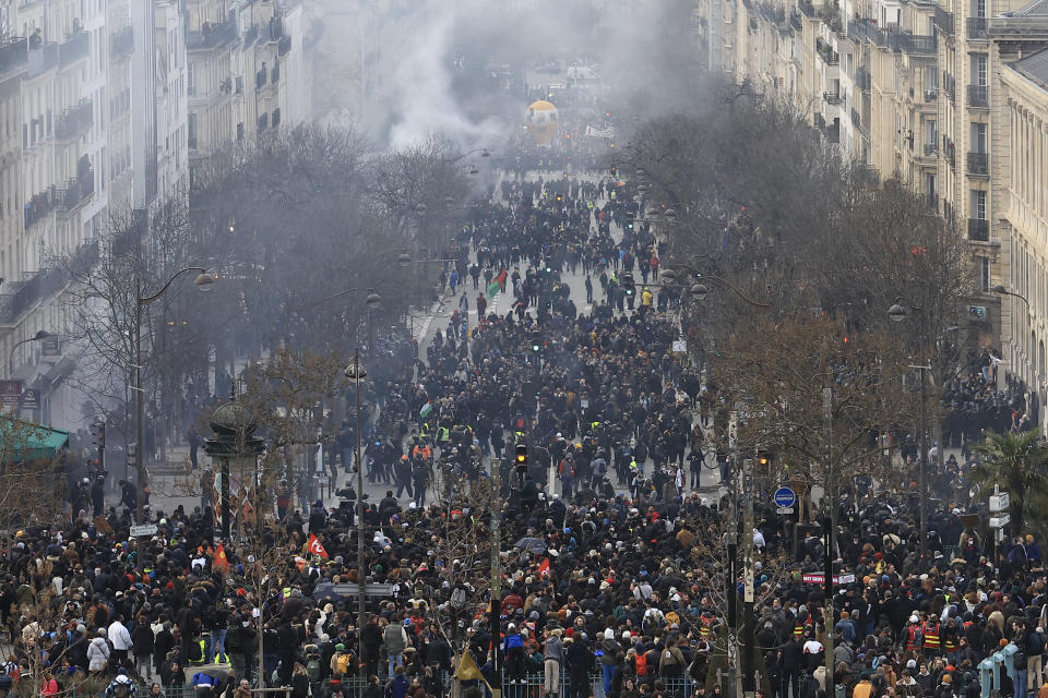Protesters march during a demonstration, Tuesday, March 7, 2023 in Paris. Hundreds of thousands of demonstrators across France took part Tuesday in a new round of protests and strikes against the government's plan to raise the retirement age to 64, in what unions hope will be their biggest show of force against the proposal. (AP Photo/Aurelien Morissard)