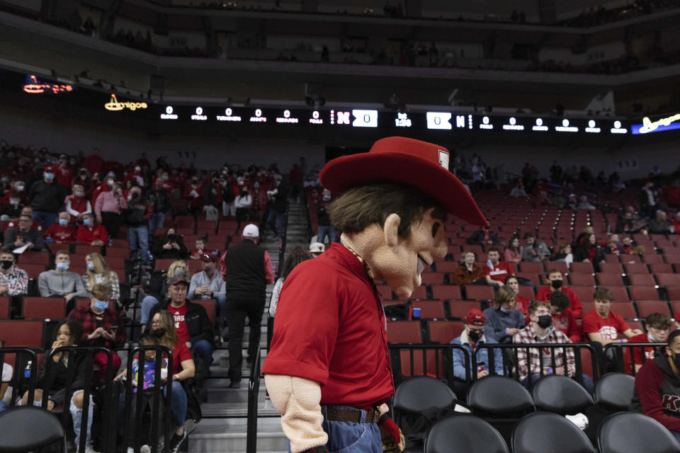 With less than two minutes remaining before tipoff, Nebraska mascot Herbie Husker walks around to greet fans before an NCAA college basketball game against Northwestern Saturday, Feb. 5, 2022, in Lincoln, Neb.As Nebraska grinds through one of the worst men's basketball seasons in program history under third-year coach Fred Hoiberg, the empty seats at Pinnacle Bank Arena are growing in number. (AP Photo/Rebecca S. Gratz)