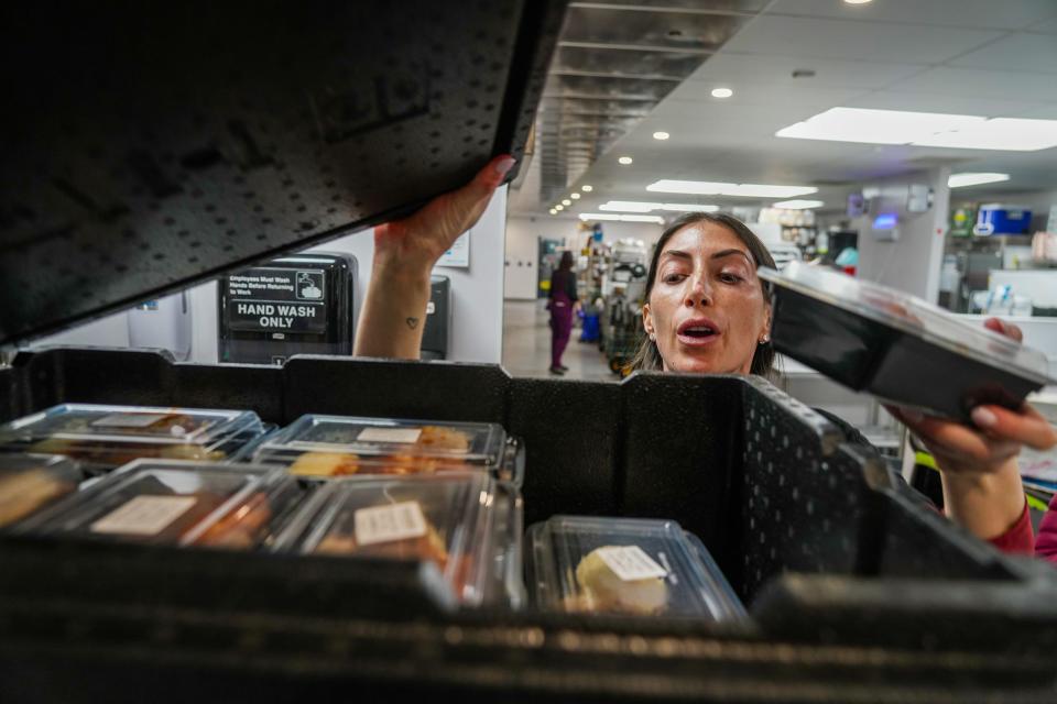 Ari Vinograd, founder of Our Shared Kitchen, prepares food for distribution to people experiencing homelessness in downtown Austin on Monday.