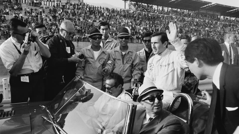 Jackie Stewart, who won the Indy 200 race, waves at the crowd before a lap of honor around the Fuji circuit in the pace car. Honda said meeting the racer, who was the same age as him, spurred his decision to pursue his calling, capturing the world’s fastest drivers on film. - Joe Honda Archive