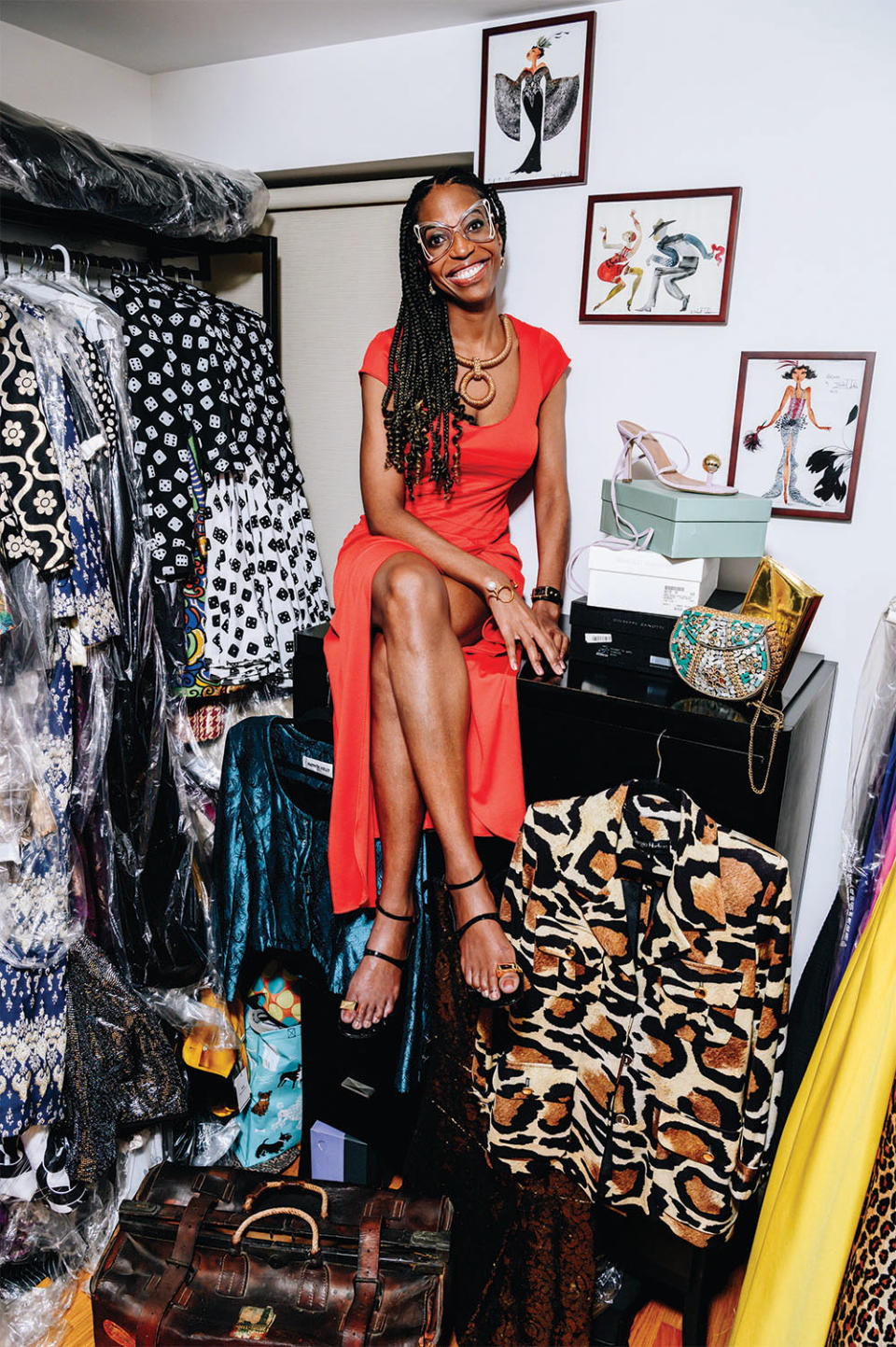 Keli Goff, photographed Nov. 22 in New York, in one of Patrick Kelly’s signature button dresses. 2 The TV writer (in a Stephen Burrows gown from the ’70s) with some of her vintage collection in her “cl-office.” The leopard-print blouse in foreground is a contemporary piece by Sergio Hudson.