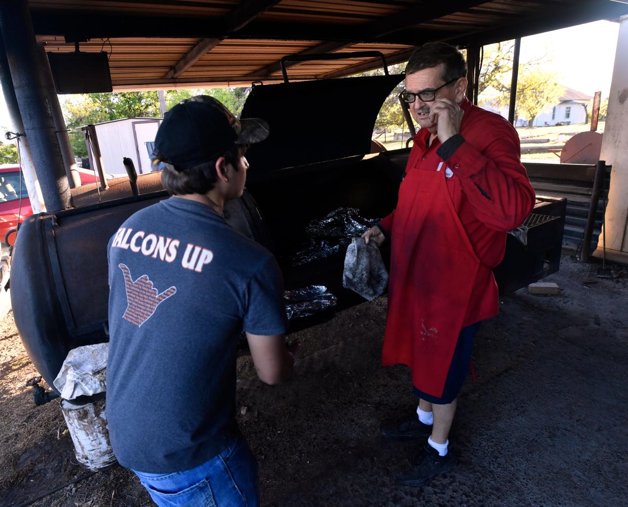 Lynn Owens gives instructions to Jonathan Salazar Friday, part of the latest class of high school students Owens has employed at his restaurant since opening in 1993.