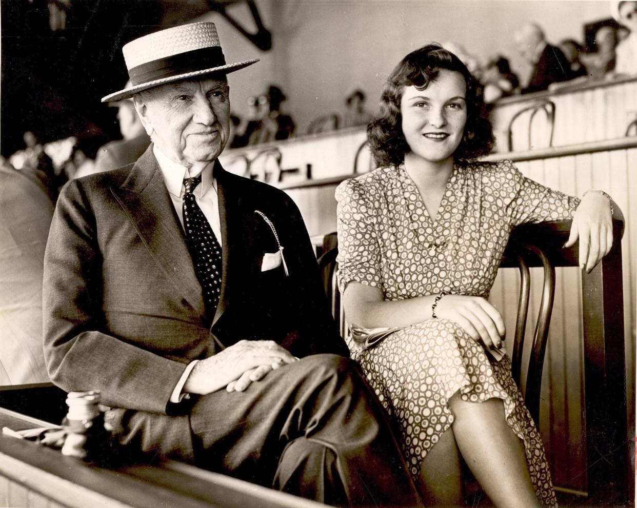 E.R. Bradley sits with Beatrice MacGuire at Saratoga Springs in August 1941. Bradley owned four horses that won the Kentucky Derby.