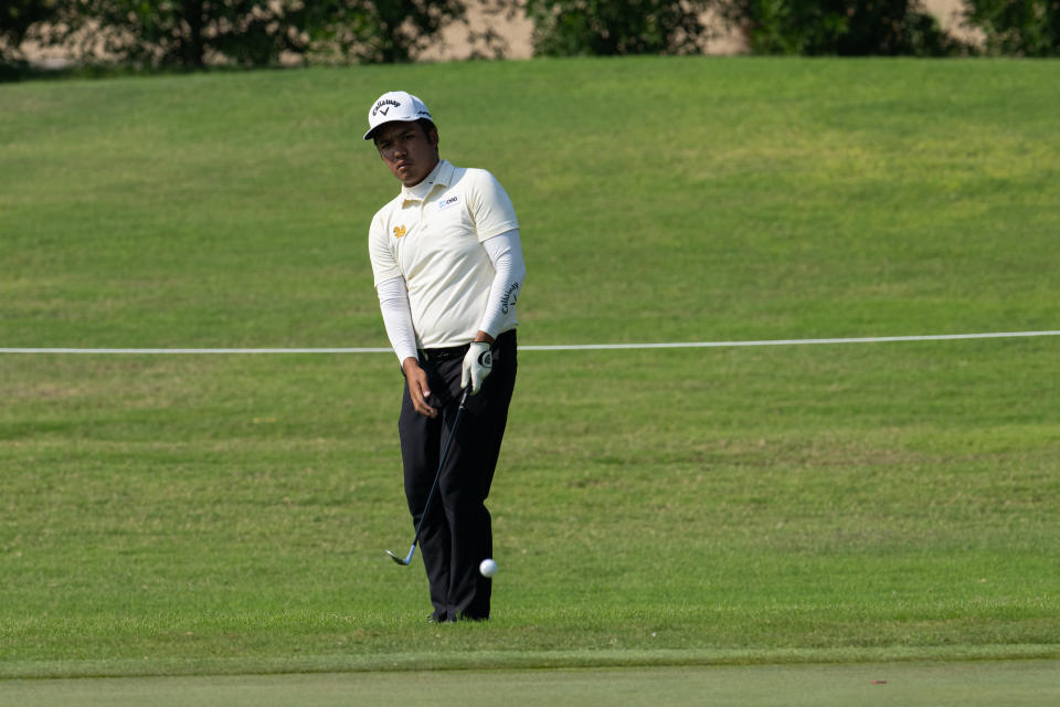 Suradit Yongcharoenchai of Thailand chips onto the 18th green during the second round of the LIV Golf Promotions at the Abu Dhabi Golf Club on Saturday, December 09, 2023 in Abu Dhabi, United Arab Emirates. (Photo by Montana Pritchard/LIV Golf)