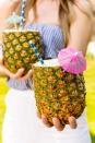 <p>Master the art of tiki mixology. </p><p>Get the recipe from <a href="https://www.delish.com/cooking/recipes/a47276/pina-colada-pineapple-cups/" rel="nofollow noopener" target="_blank" data-ylk="slk:Delish;elm:context_link;itc:0;sec:content-canvas" class="link ">Delish</a>.</p>