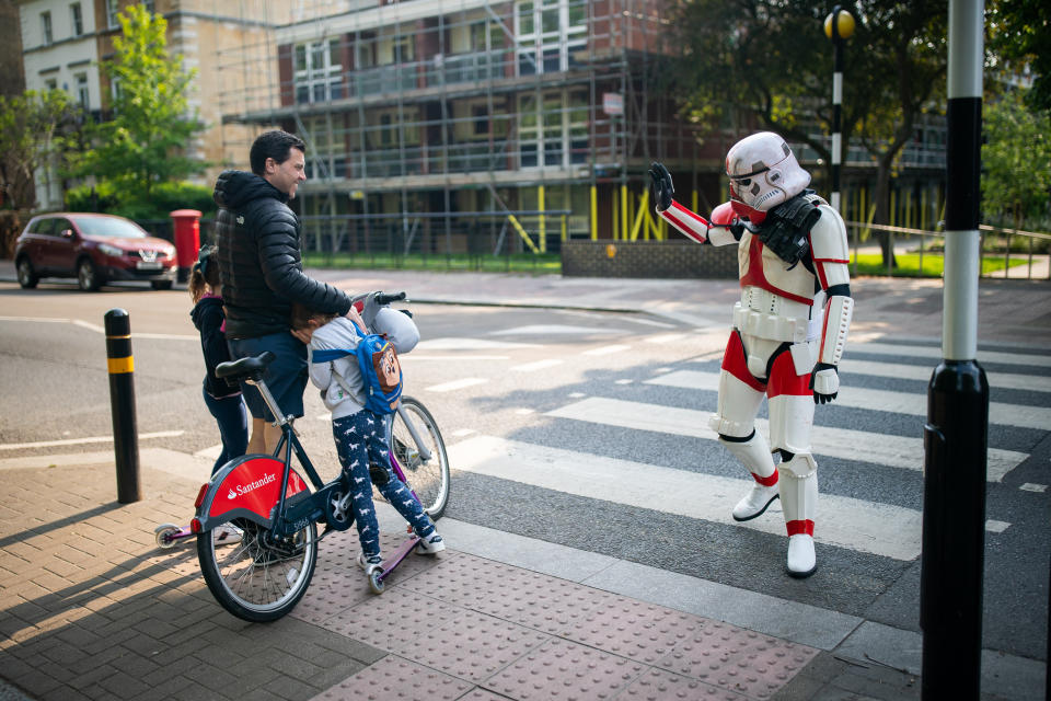 Sam Orchard dressed as a Stormtrooper out for for exercise in a South London park on the 4th May Star Wars Day 2020 as the UK continues in lockdown to help curb the spread of the coronavirus.